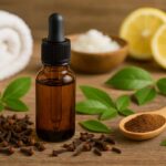 Clove oil in amber dropper bottle with dried cloves and natural ingredients on wooden table, showcasing natural uses, benefits, and DIY remedies