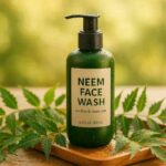A bottle of neem face wash with fresh neem leaves on a wooden tray, surrounded by nature, symbolizing clear and healthy skin.