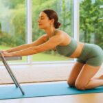 Easy Yoga for Beginners: A peaceful woman demonstrating a gentle seated twist in a chair, showing an accessible way to start a yoga practice at home.